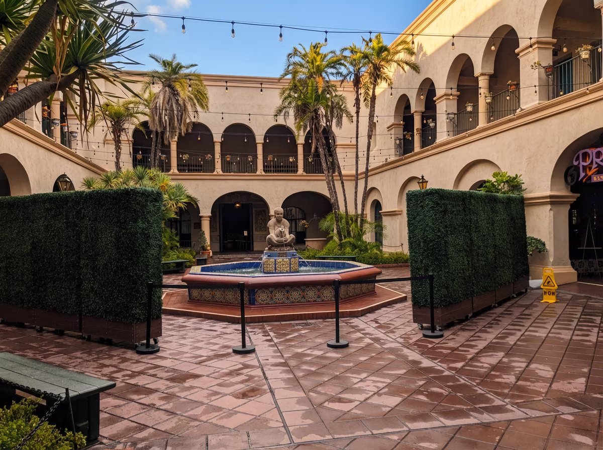 UV-resistant boxwood hedges lining outdoor dining area
